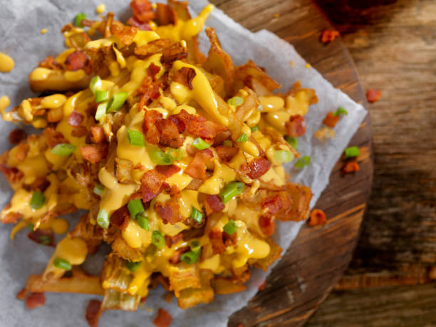 istock Loaded Blooming Onion with Fries, Cheese Sauce and Bacon 896421902