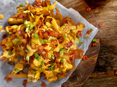 Loaded Blooming Onion with Fries, Cheese Sauce and Bacon
