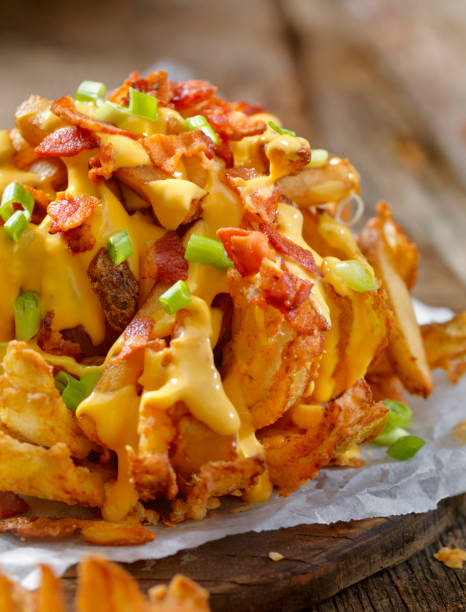 istock Loaded Blooming Onion with Fries, Cheese Sauce and Bacon 896422320