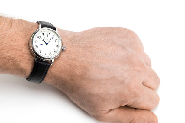 istock a men wearing a watch with black leather strap over a white background 896427274