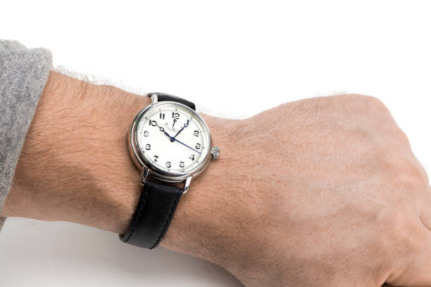 istock a men wearing a watch with black leather strap over a white background 896427316