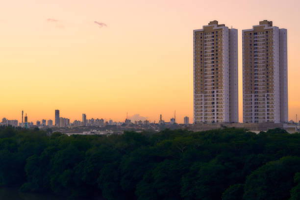 Two twin buildings with the city of Cuiabá in the background at a beautiful sunset - Photograph taken from above the bridge Sérgio Motta. stock photo