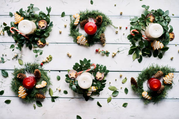 istock Candles surrounded by small Christmas wreaths 896433116