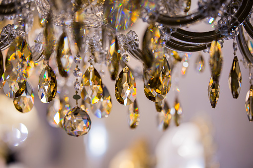Chrystal chandelier close-up. Glamour background with copy space. Vintage crystal lamp details.