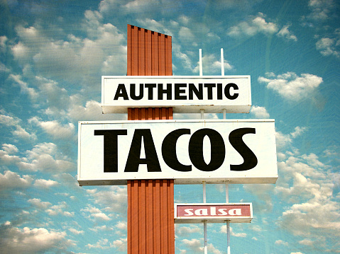 aged and worn authentic tacos sign
