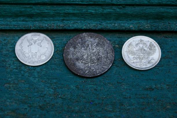 istock set of retro silver coins on a green board 896433510