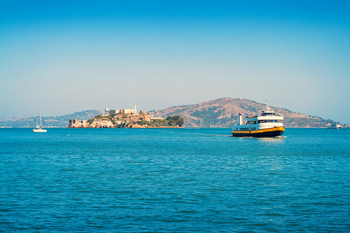 Stock photograph of a ferry with visitors coming from Alcatraz Island in San Francisco, California, USA on a sunny day.