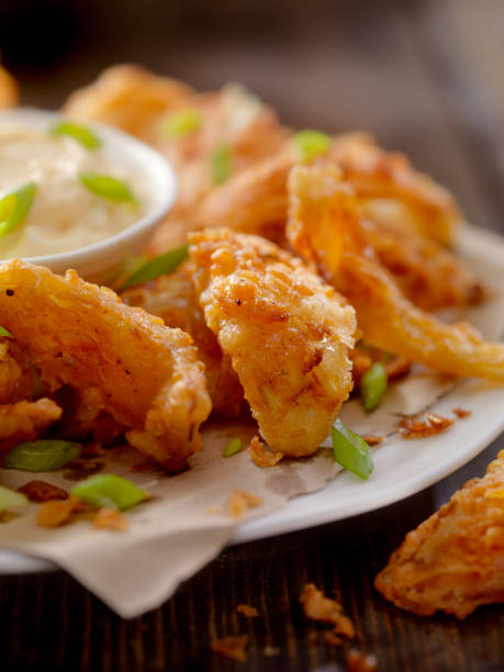 istock Deep Fried Onion Petals with Dipping Sauce 896439022