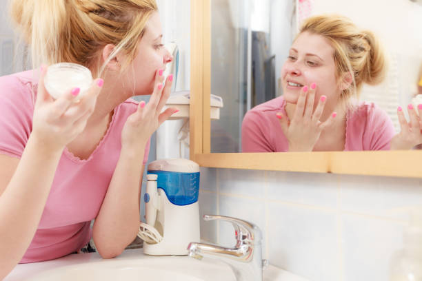 istock Woman applying face cream with her finger 896441620