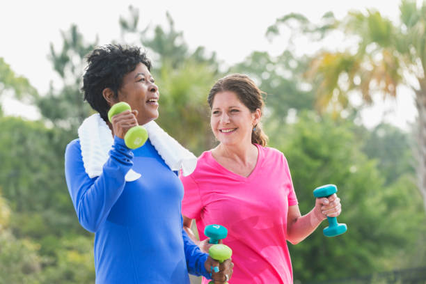 istock Two mature women in the park exercising 896455396