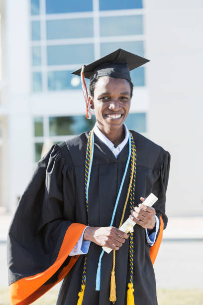 istock Young man graduating from high school or university 896458266