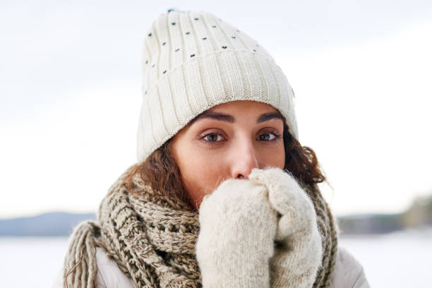 istock Charming girl warming hands outdoors 896458574