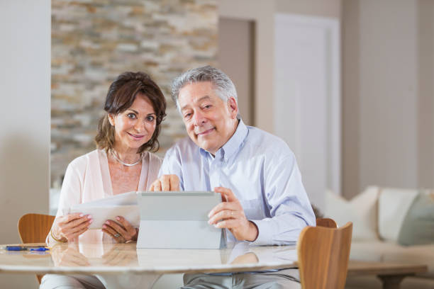 istock Senior couple paying bills online 896461134