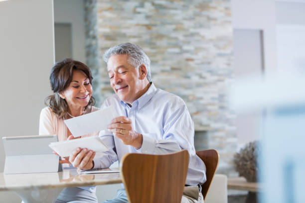 istock Senior couple paying bills online 896461176