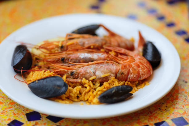 istock Paella. Rice with king prawns and mussels 896463828