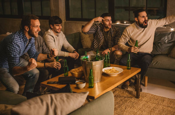 istock Weekends are for watching their favourite sport 896466650