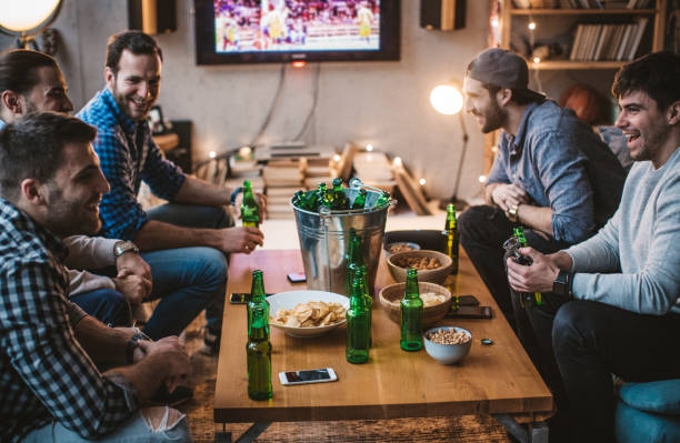 istock Group of best friends watching match on TV 896469492