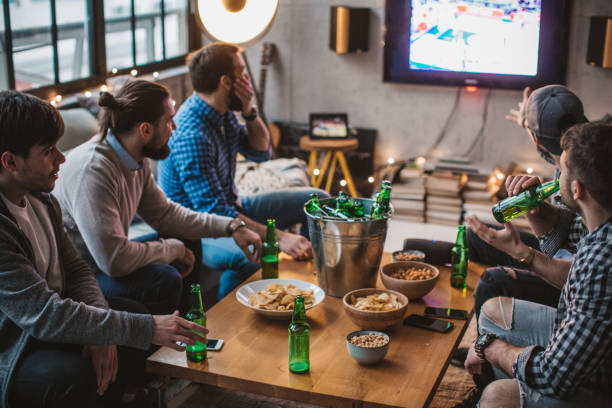 istock Watching match of the day 896472560
