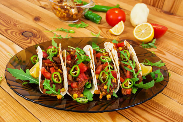 istock Mexican tacos with beef in tomato sauce 896472812
