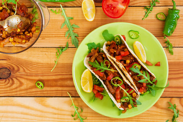 istock Mexican tacos with beef in tomato sauce 896472814
