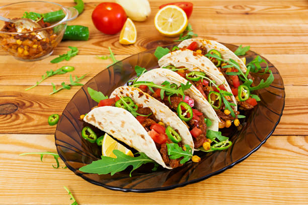istock Mexican tacos with beef in tomato sauce 896472824