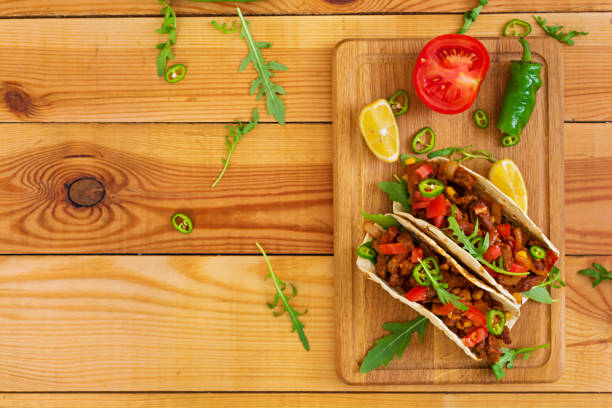 istock Mexican tacos with beef in tomato sauce 896472828