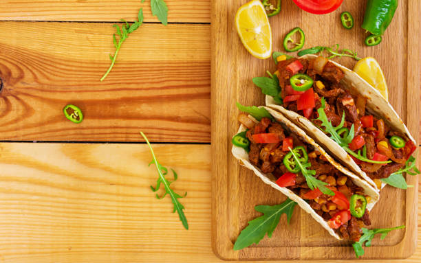 istock Mexican tacos with beef in tomato sauce 896472848