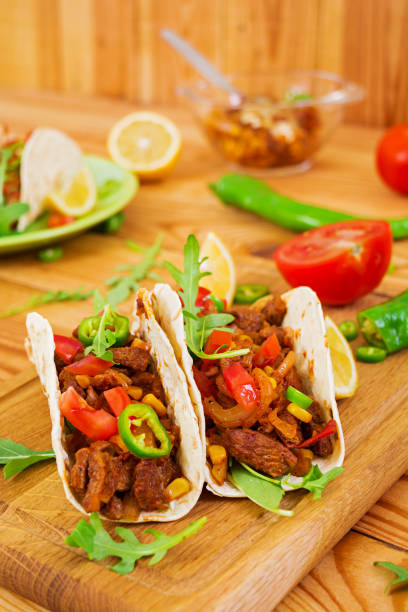 istock Mexican tacos with beef in tomato sauce 896472854