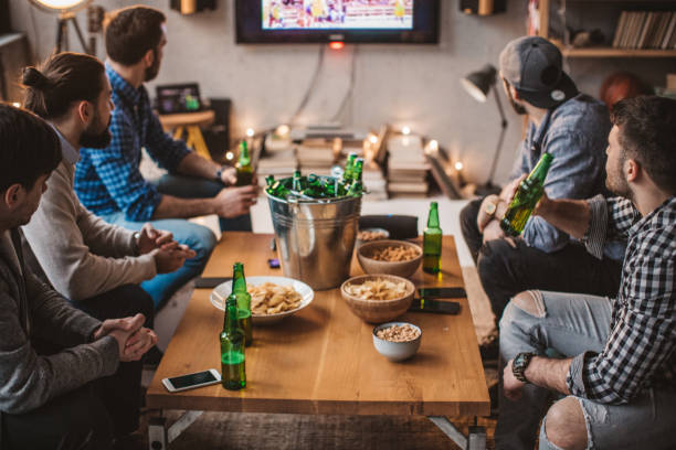 istock Watching match of the day 896473176