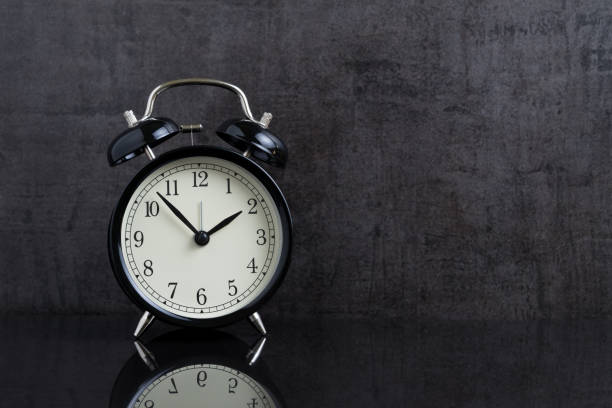 istock Time passing with black alarm clock in retro dark black background with copy space 896483012