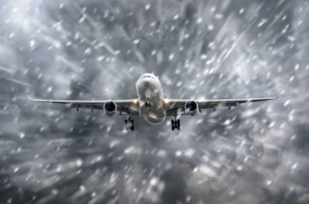 istock Airplane approaching on a landing in snowstorm bad weather. 896489884