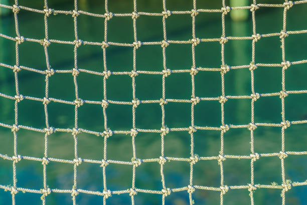 istock rope network with knots and square cells with background 896551028