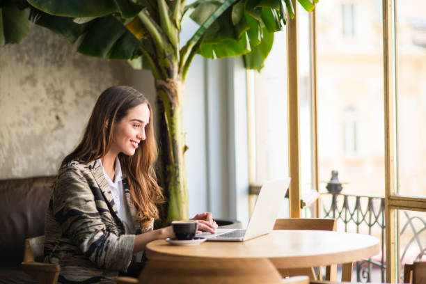 istock Smiling business woman using laptop. 896551104