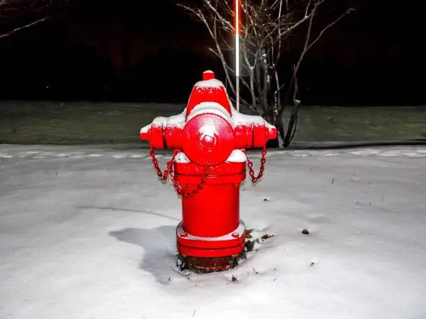 Photo of red fire hydrant and snow