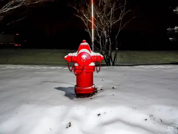 Photo of red fire hydrant and snow