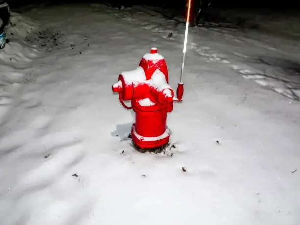 Photo of red fire hydrant and snow