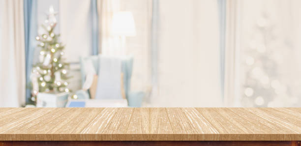 istock Empty wood table top with abstract warm living room decor with christmas tree blur background with bokeh light,Holiday backdrop,Mock up banner for display of advertise product ,luxury house. 896558758