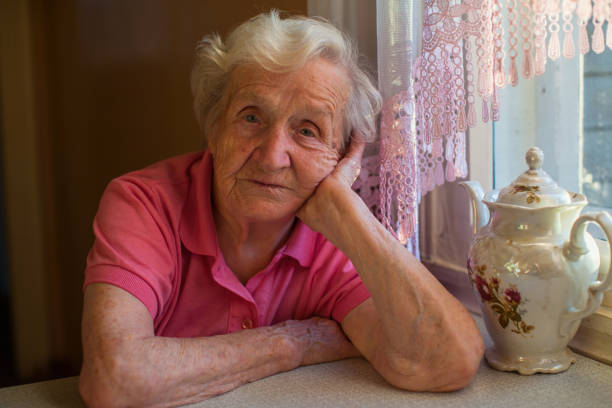 istock Portrait of elderly woman drinking tea at table. 896563722