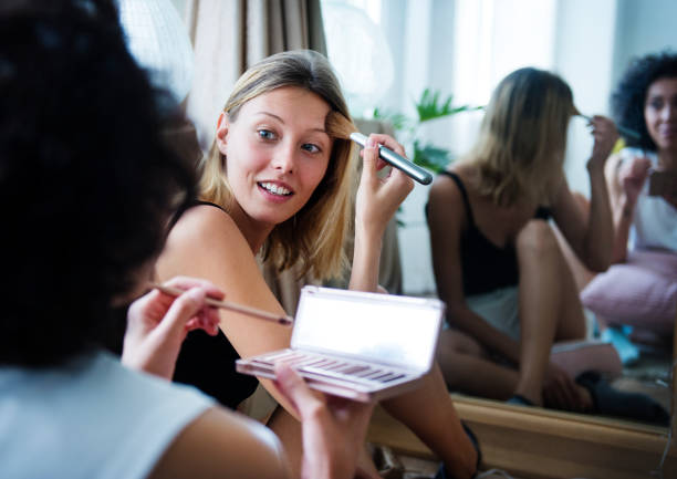 istock Women putting on a makeup 896564028