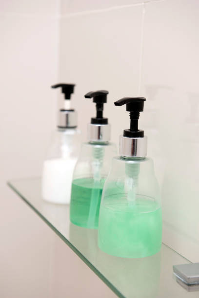 istock Soap, shampoo, and conditioner in bottles on shelf in bathroom 896573338