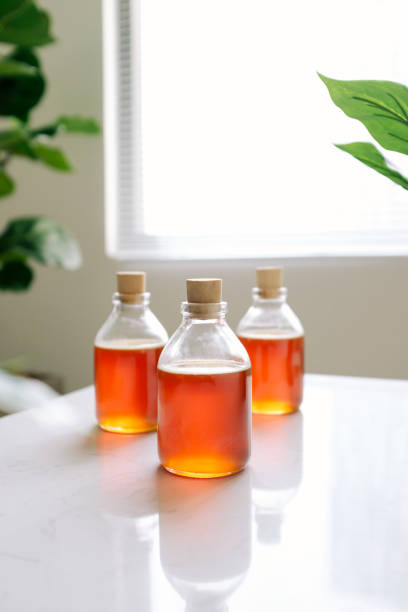 istock Glass can full of honey on table. 896579970