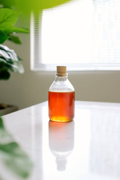 istock Glass can full of honey on table. 896584130