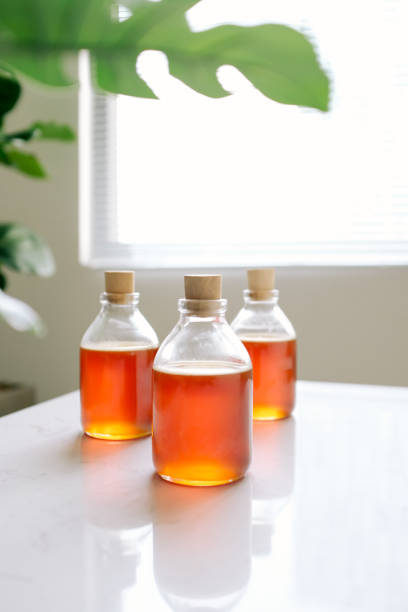 istock Glass can full of honey on table. 896586426