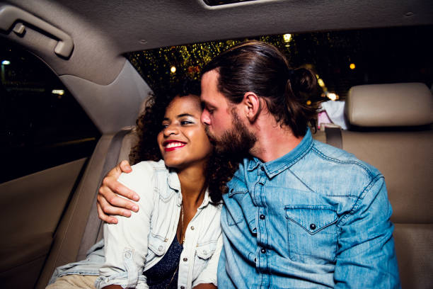 istock Couple in a backseat 896586742