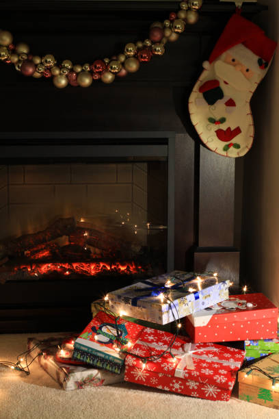 istock Christmas gifts near fireplace 896589300