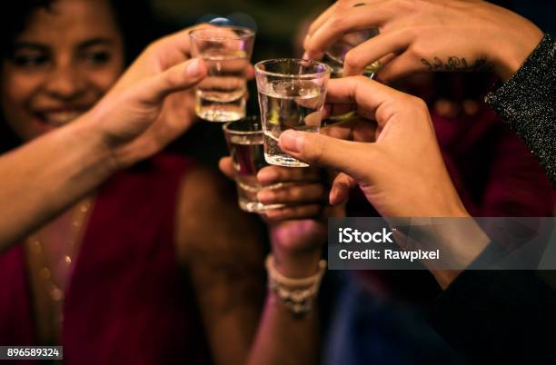 People Celebrating In A Party Stock Photo - Download Image Now - Shot Glass, Alcohol - Drink, Vodka