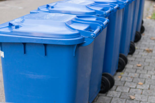 istock blue dustbin in a row on street 896596926