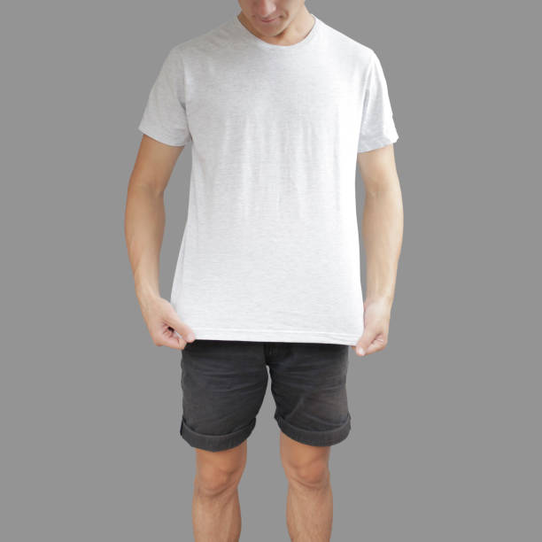 istock White stretched t shirt and black shorts on a young man template on grey background. 896608542