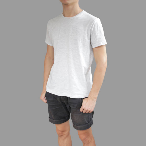 istock White t shirt and black shorts on a young man template on grey background. 896608550