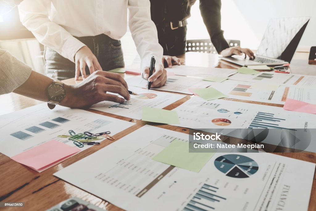 Business People Analyzing Statistics Business Documents,  Financial Concept Market Research Stock Photo